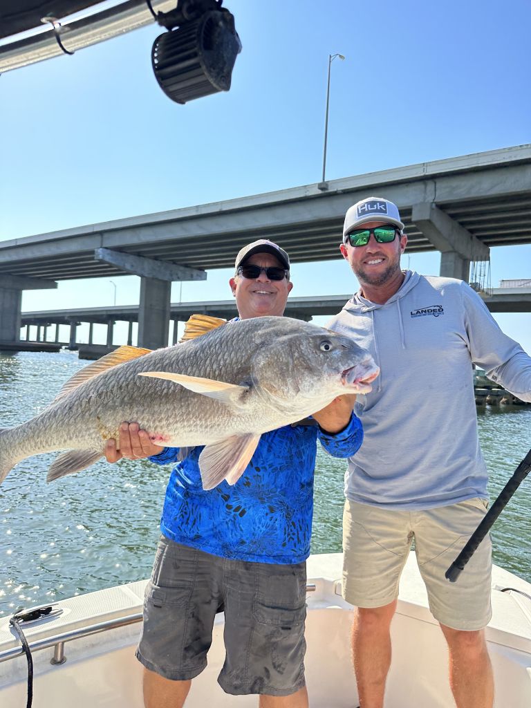 fishing charter under a bridge